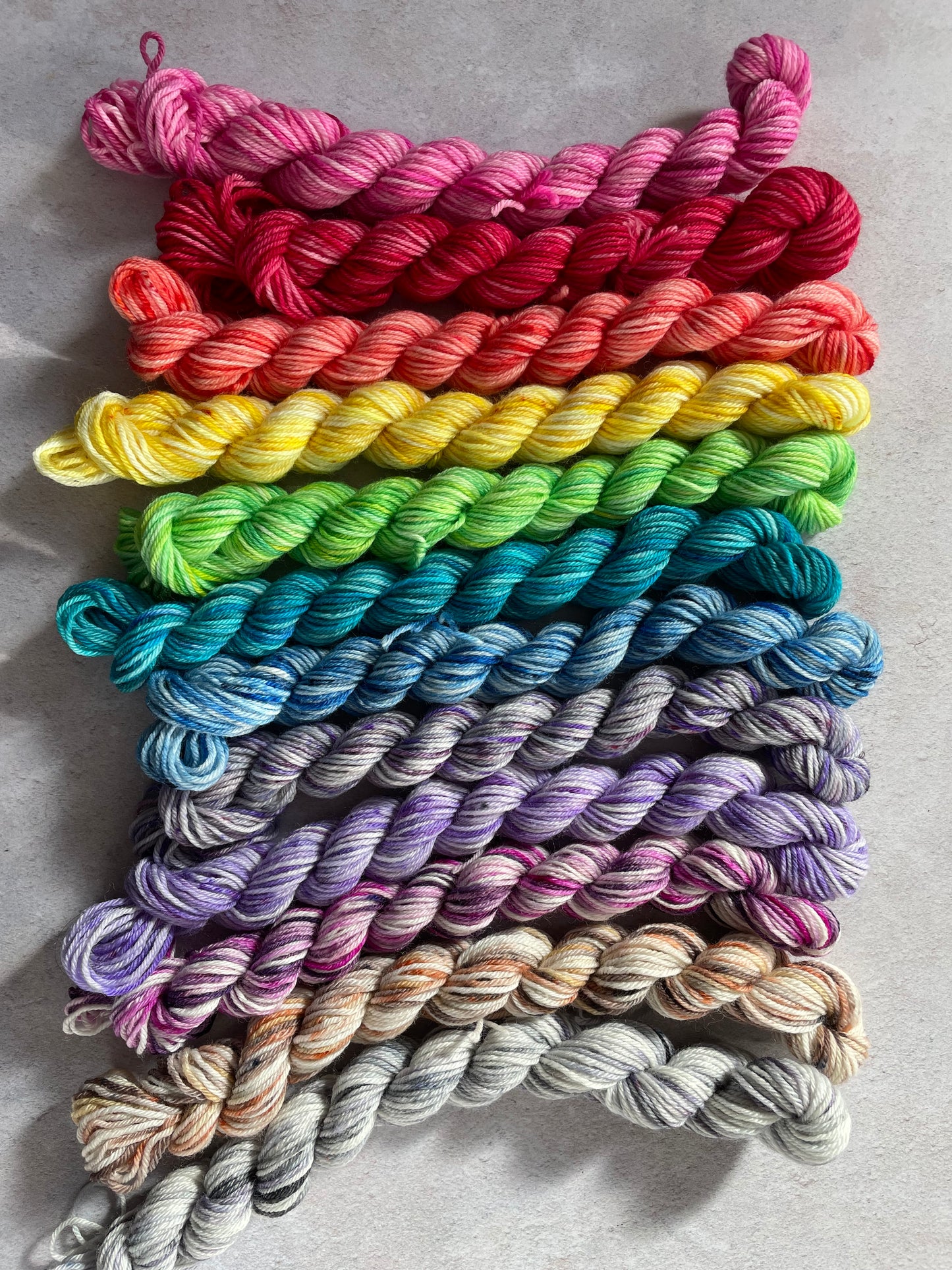 Medium bright rainbow sock yarn bundle with 12 mini skeins
