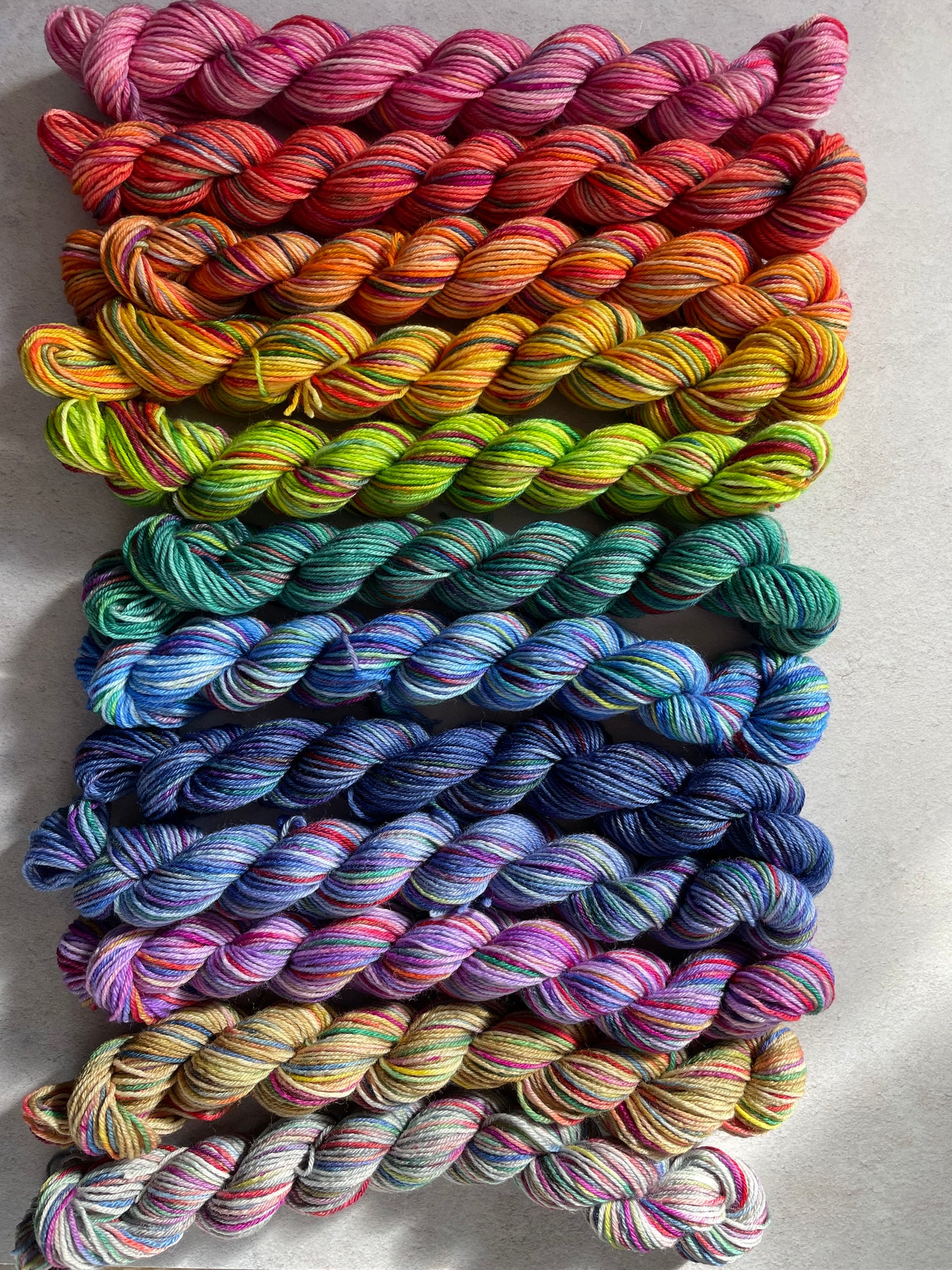Medium bright rainbow sock yarn bundle with 12 mini skeins