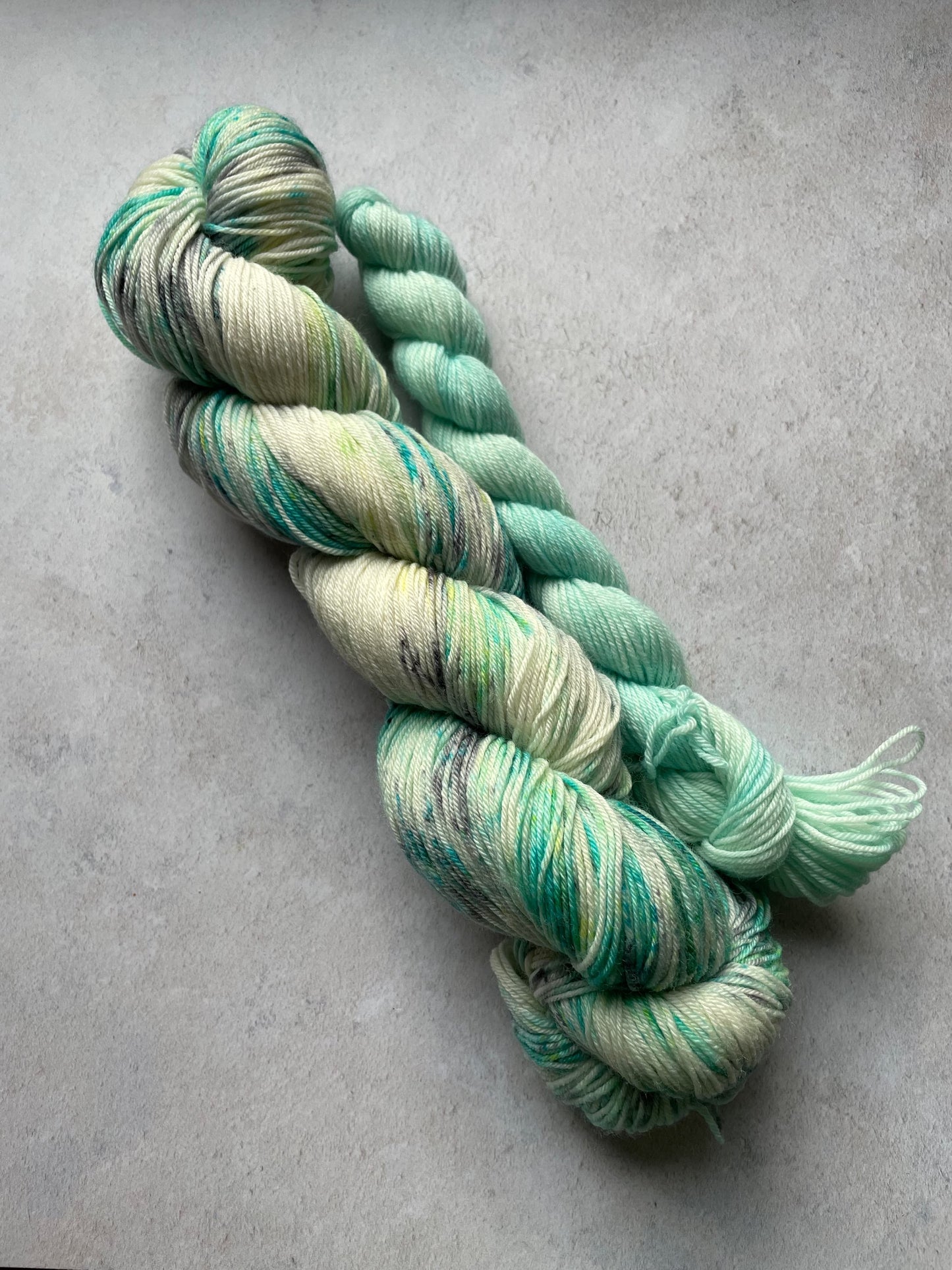 120g sock set with aqua and grey speckled main skein and aqua mini skein