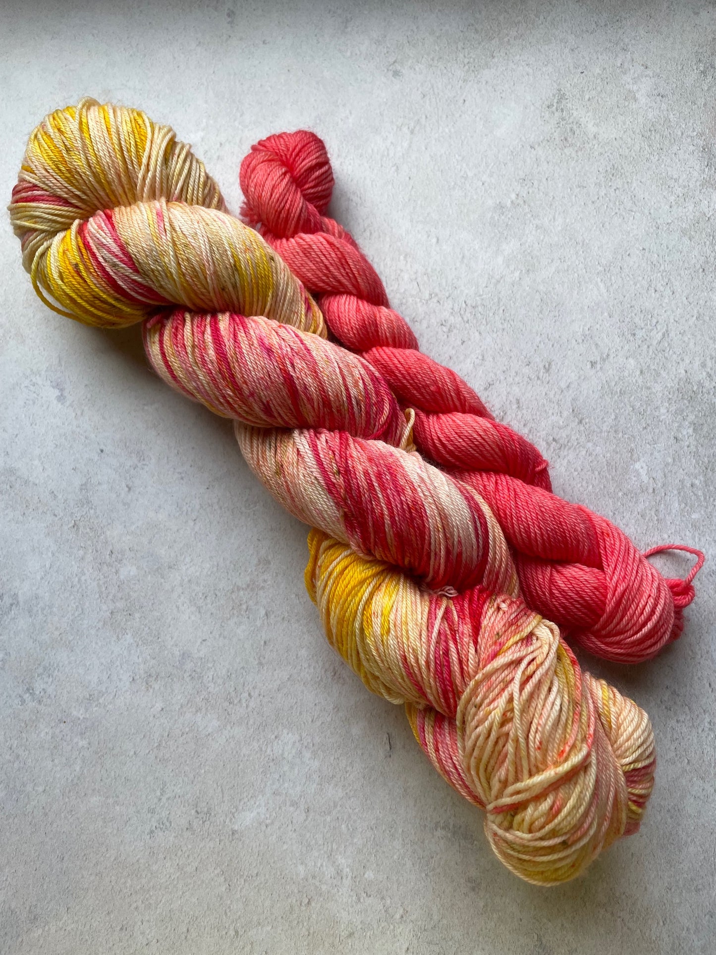 120g sock set with red and yellow main skein and red mini skein