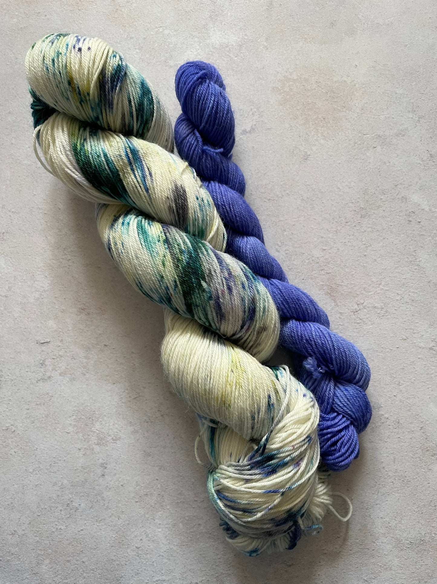 120g sock set with cream emerald and violet main skein and violet mini skein
