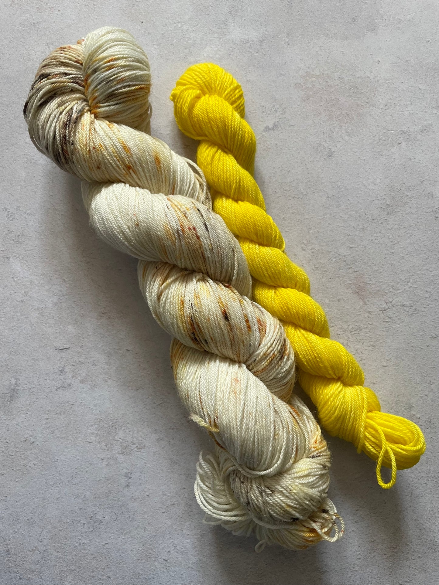 120g sock set with cream and lightly speckled main skein and yellow mini skein