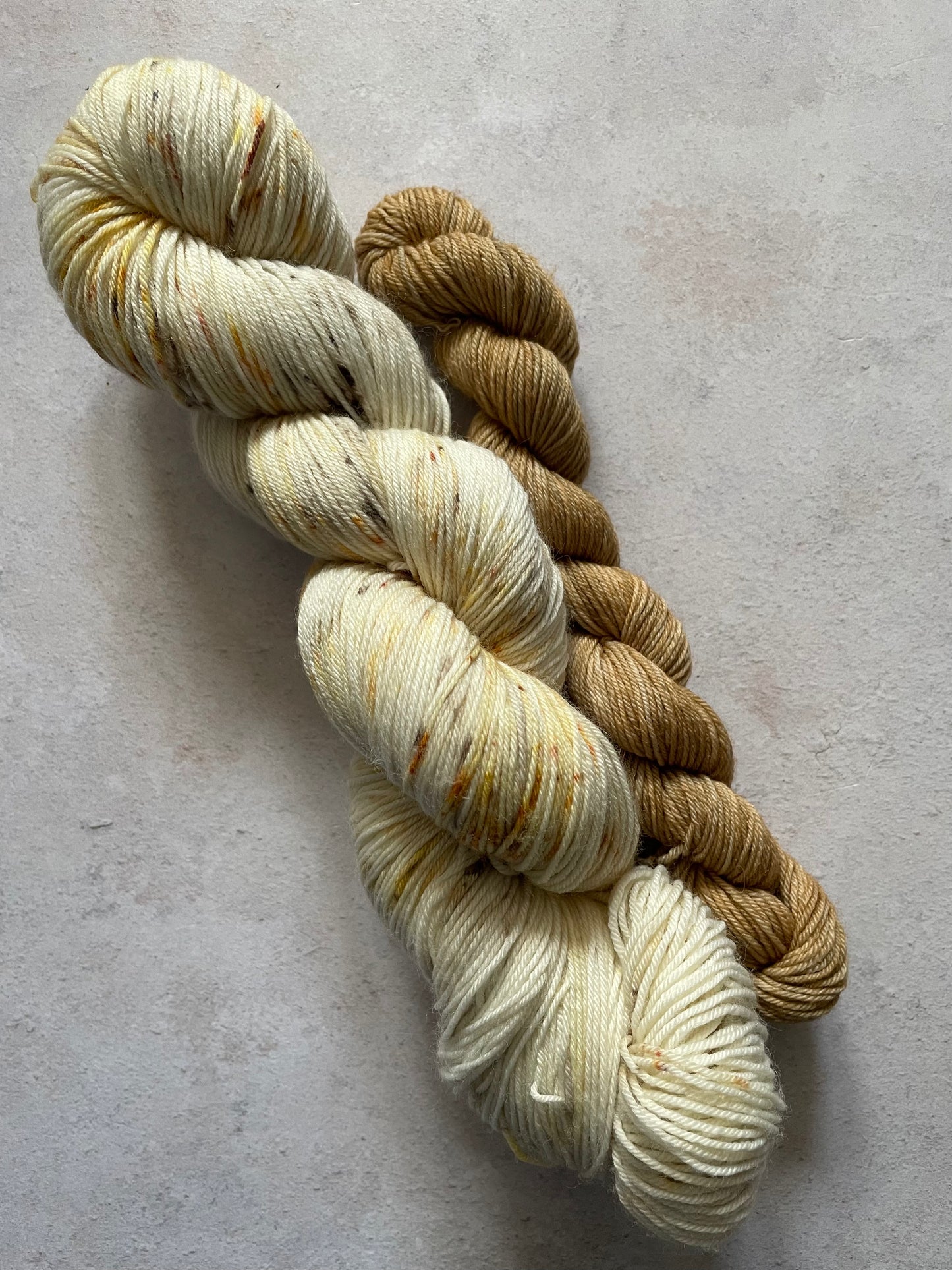 120g sock set with cream and lightly speckled main skein and brown mini skein