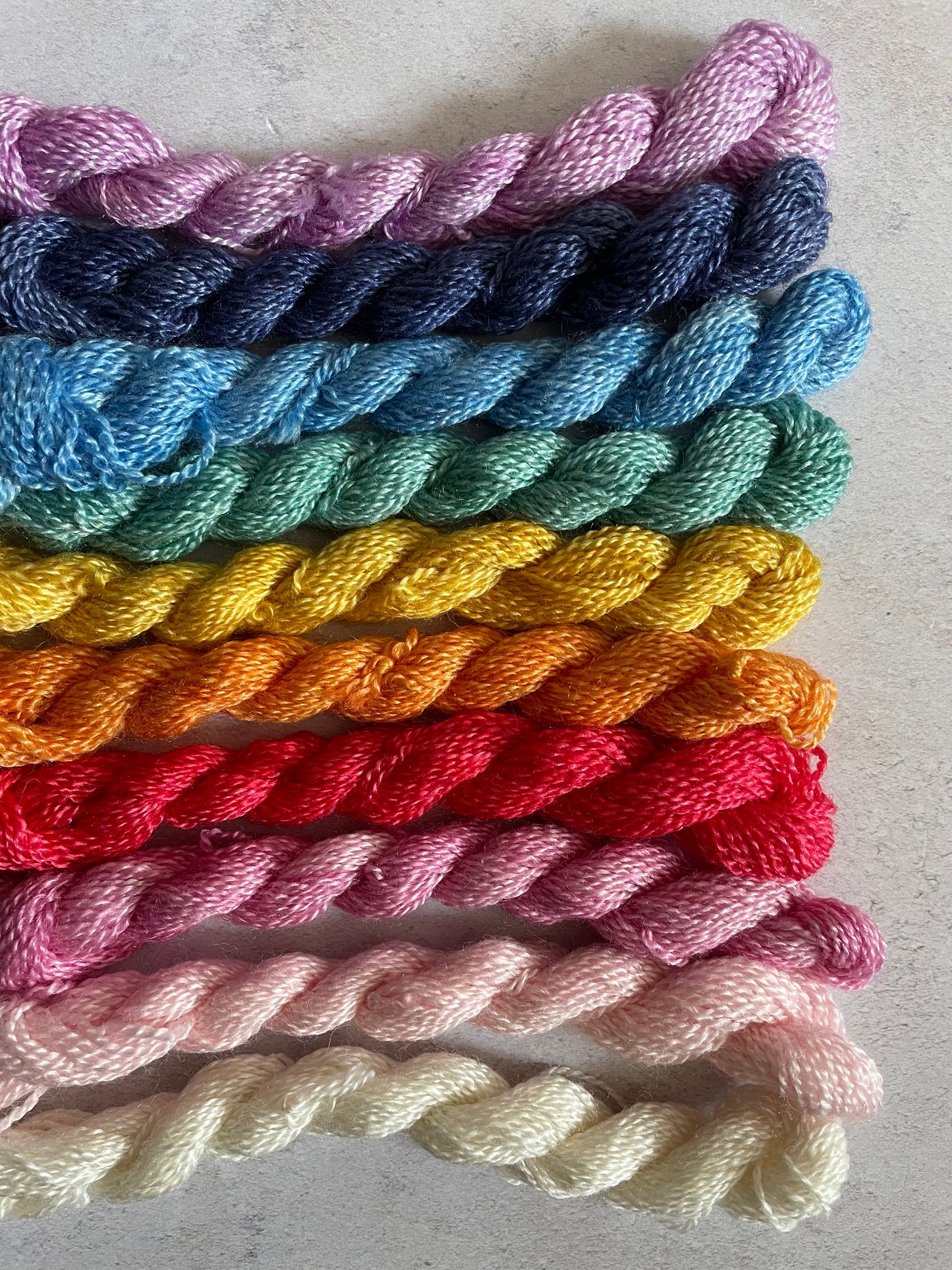 Bundle of embroidery threads in a rainbow selection