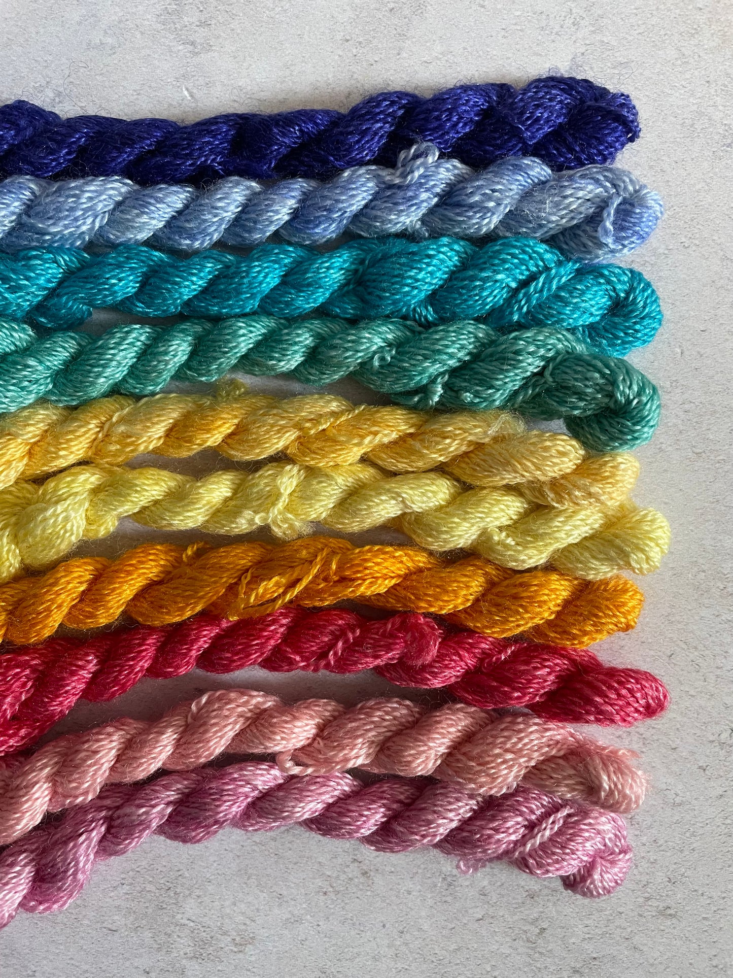 Bundle of embroidery threads in a rainbow of colours