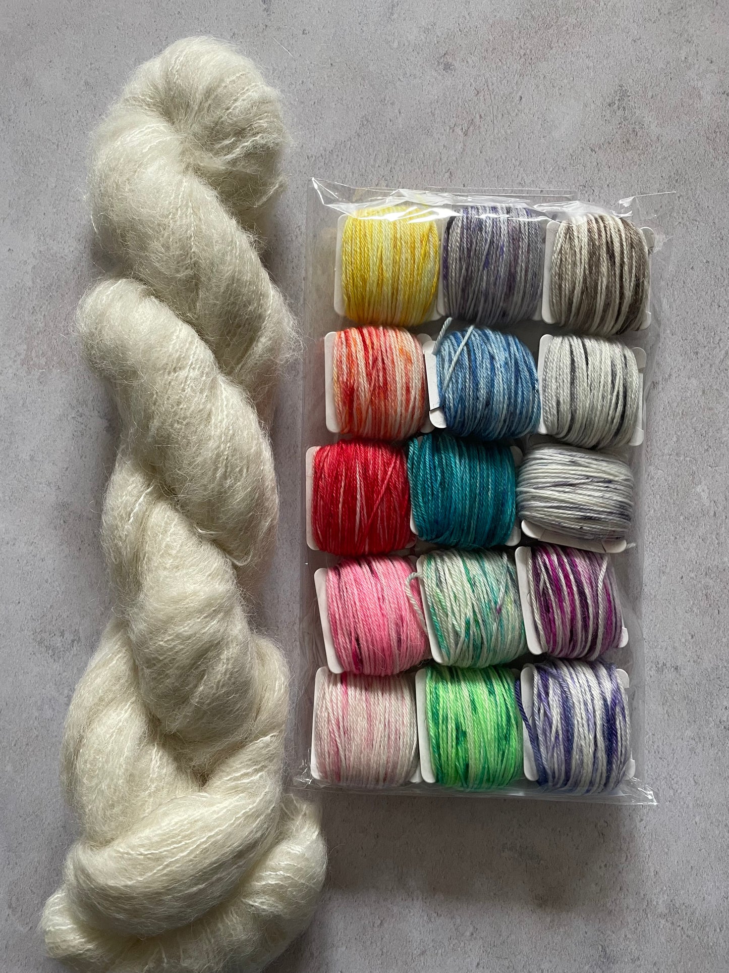 Skein of suri alpaca and silk and 15 5g bobbins of sock yarn