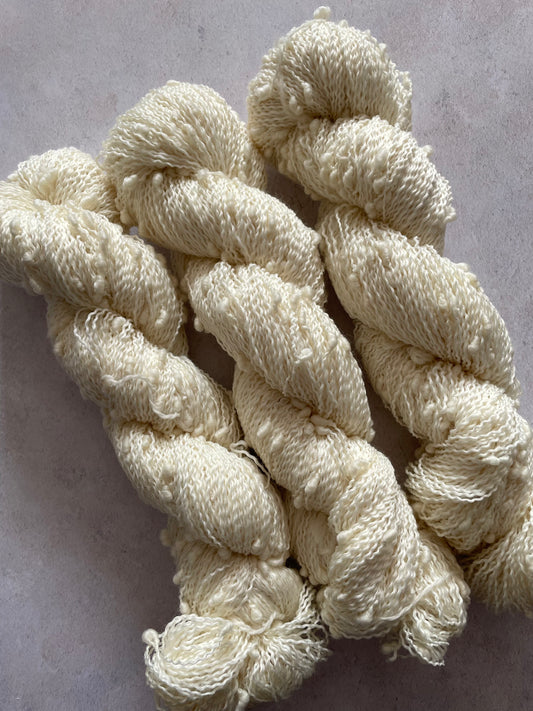 Three skeins of slub yarn - a textured and bumpy yarn