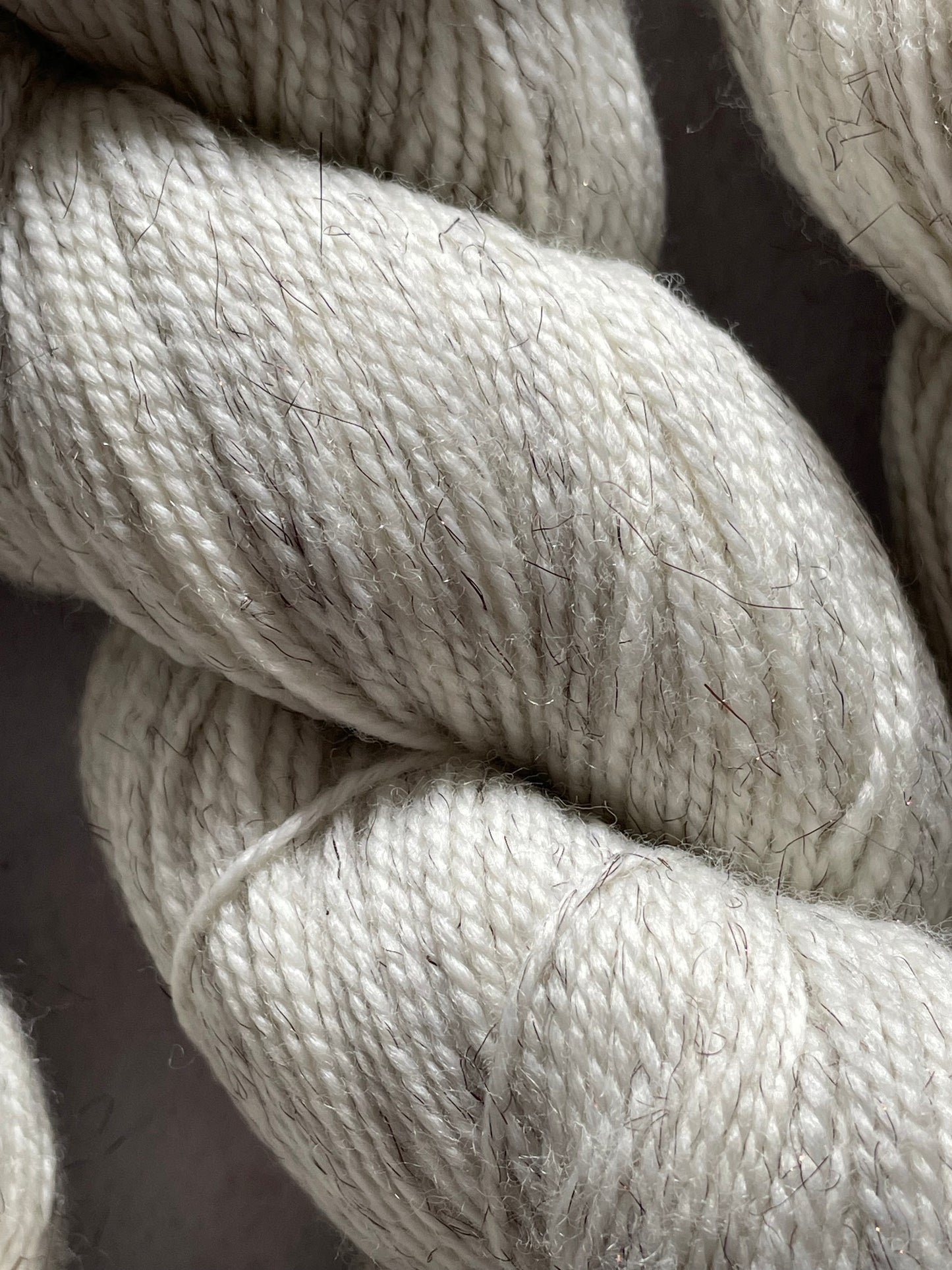 A close up of the undyed bronze sparkle sock yarn
