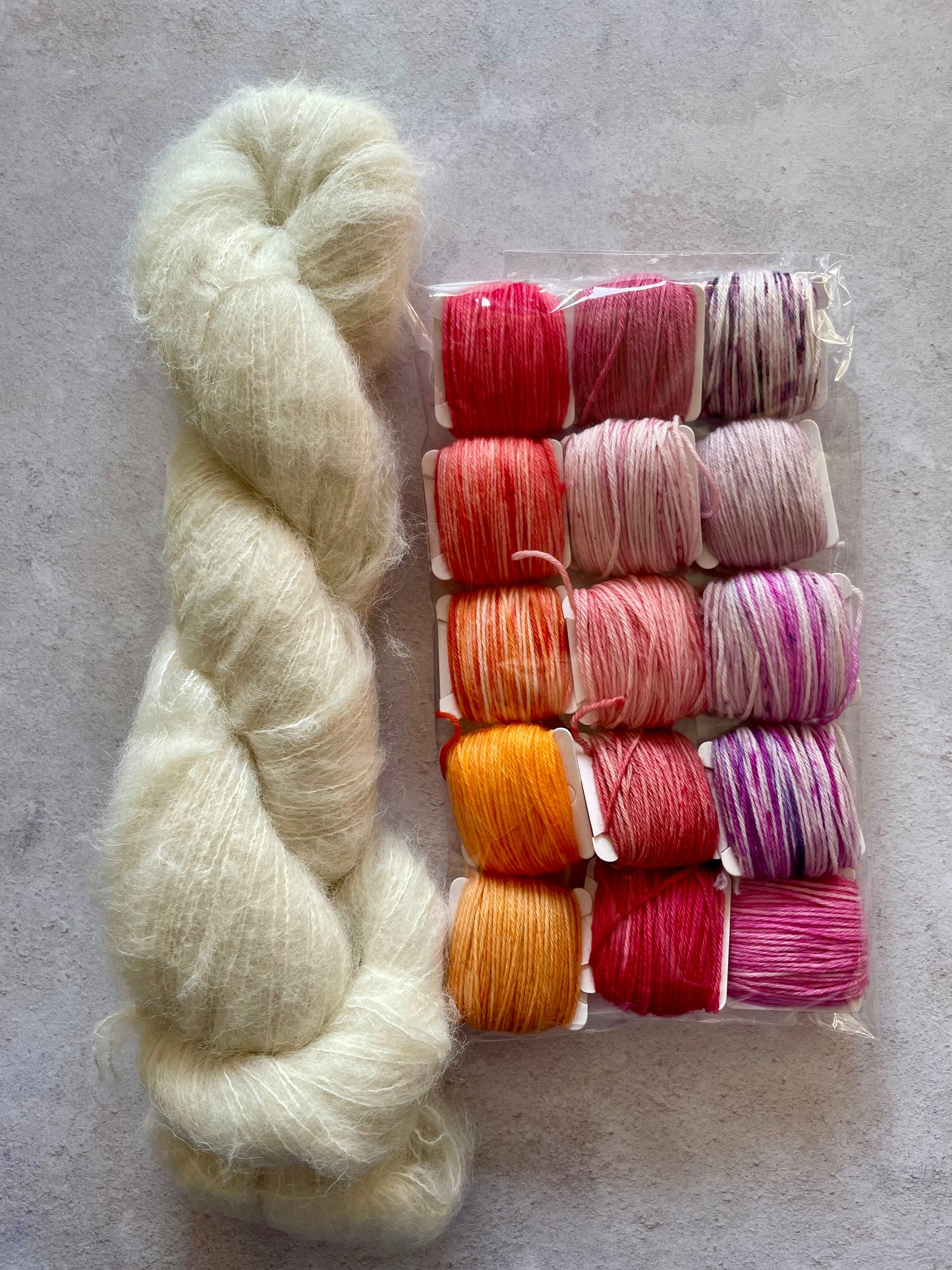 50g of our suri alpaca and silk base with 15 5g bobbins of scrappy yarn