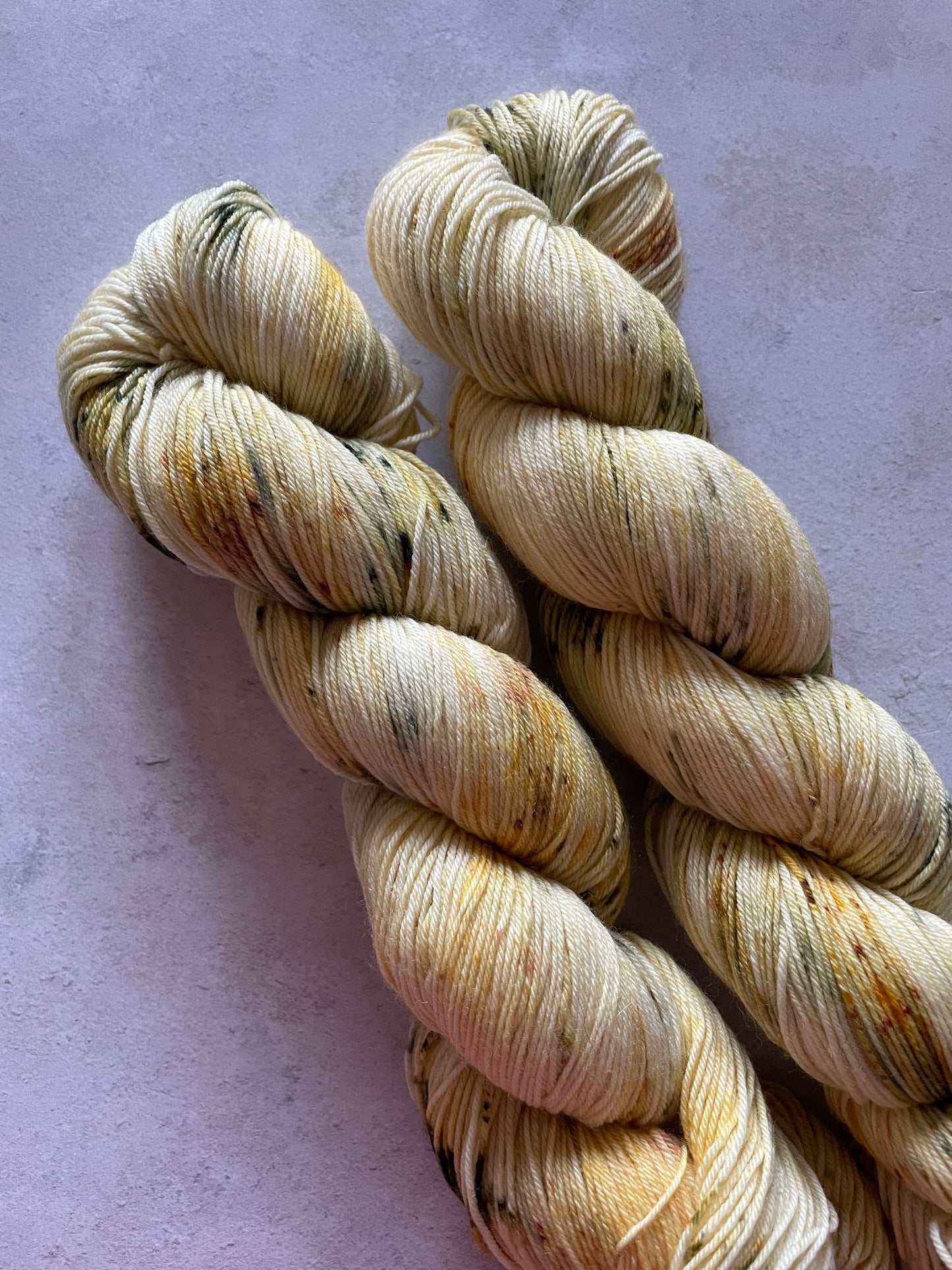 2 skeins with yellow and olive green speckles