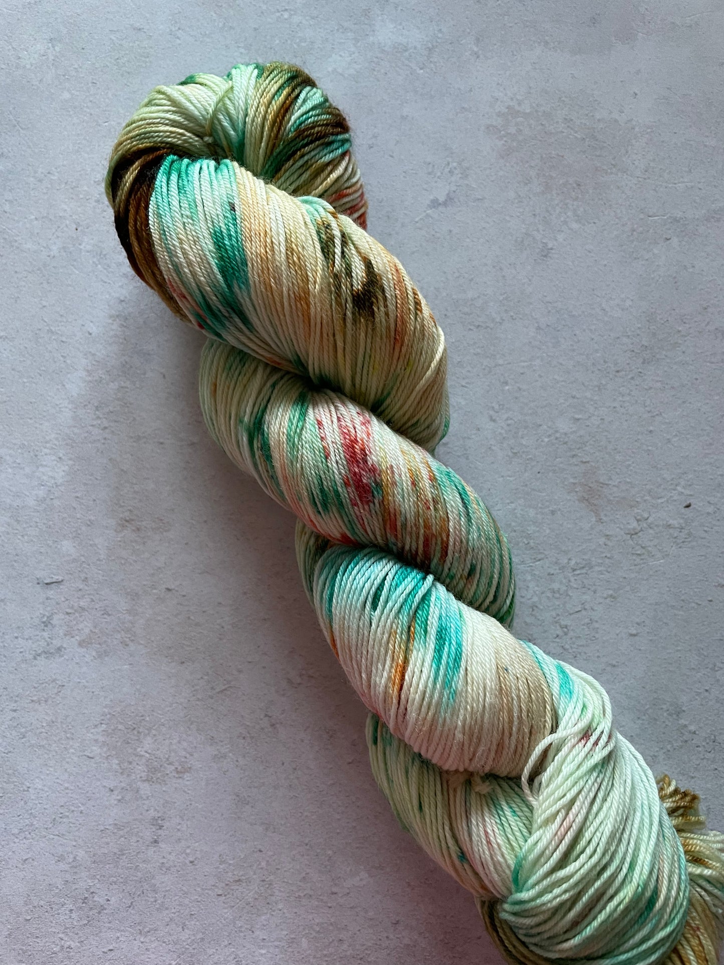Skein of yarn with brown, red and green