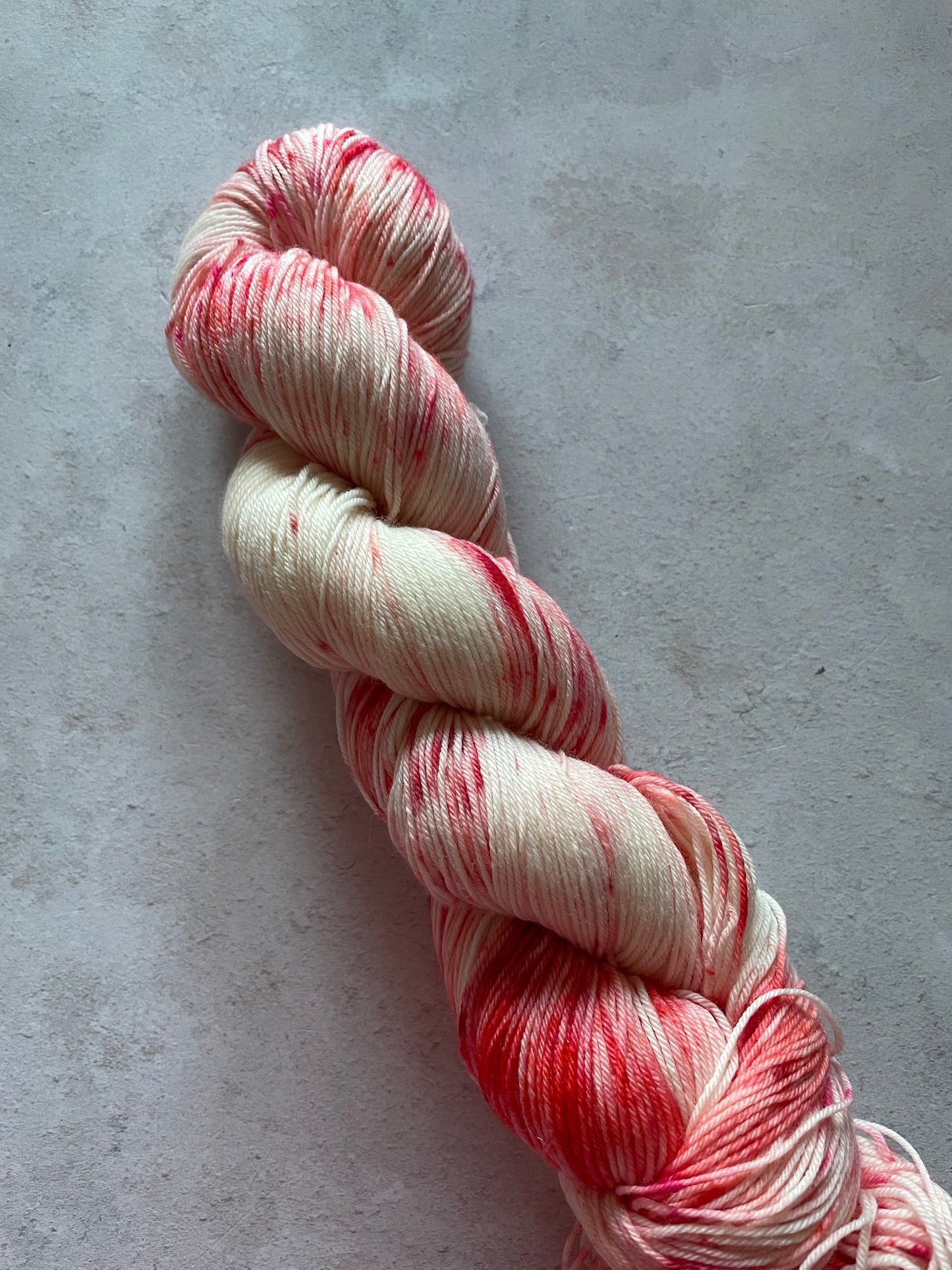 Skein of yarn with red and white
