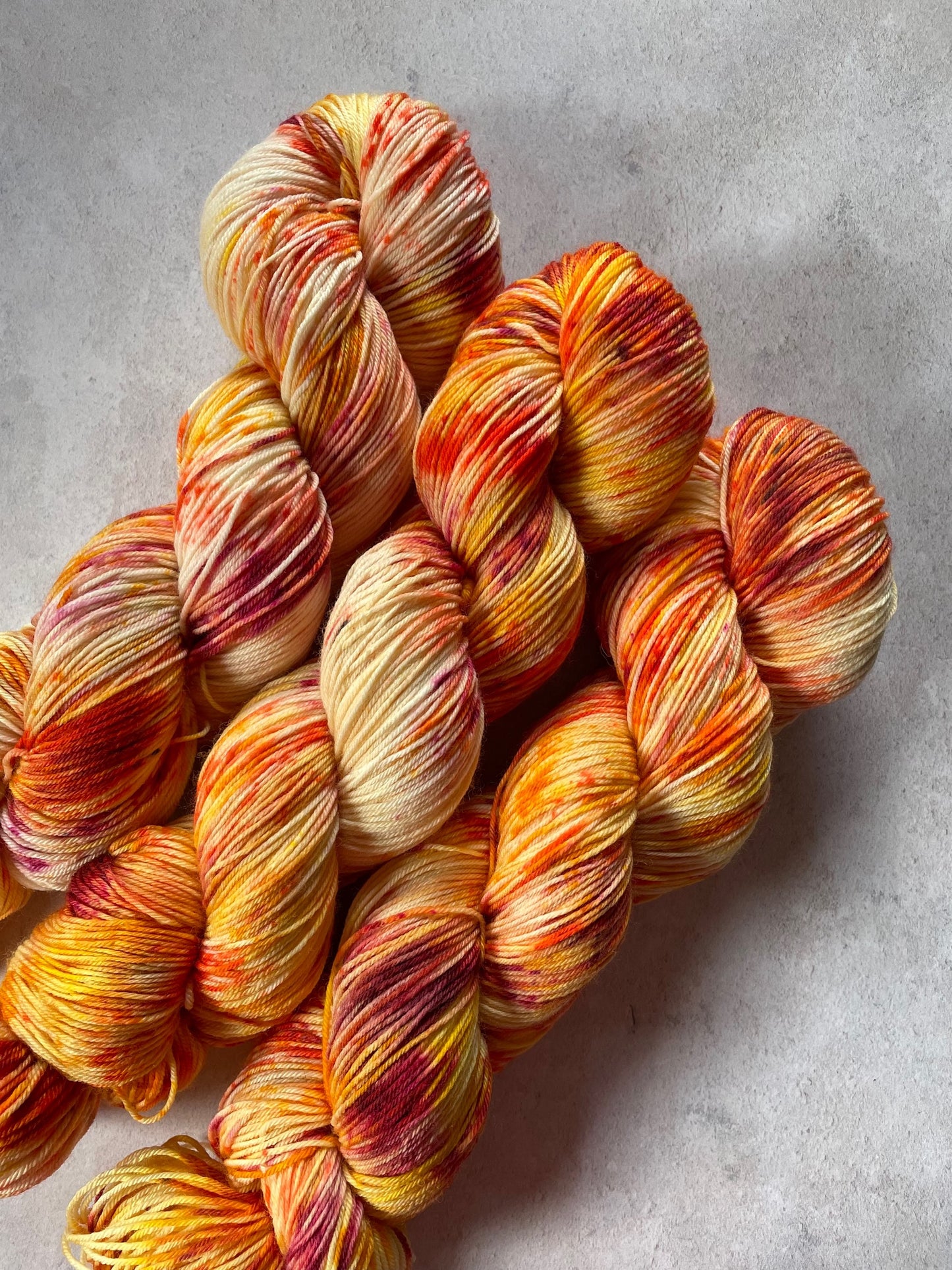 Poor little mite skeins - Mary Poppins collection image - oranges and reds