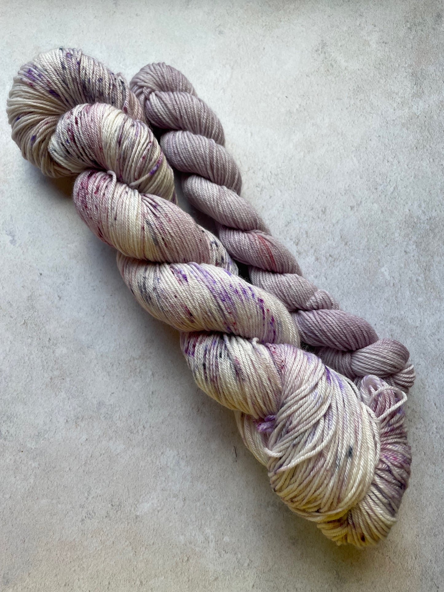 120g sock set with lightly speckled lilac main skein and lilac mini skein