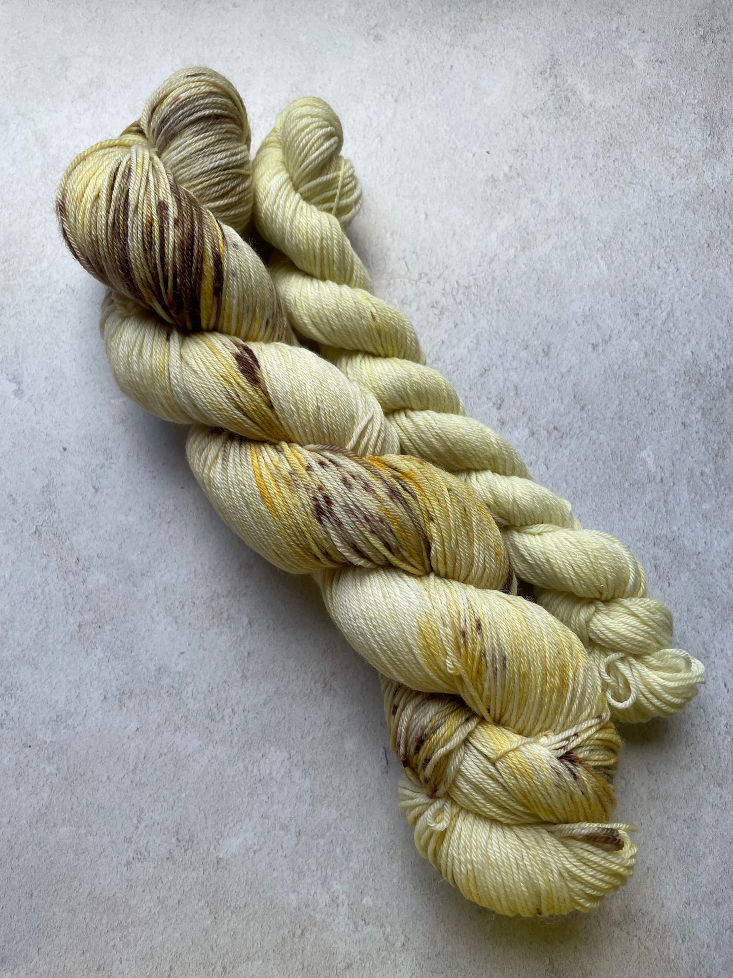 120g sock set with gold and brown speckled main skein and cream mini skein