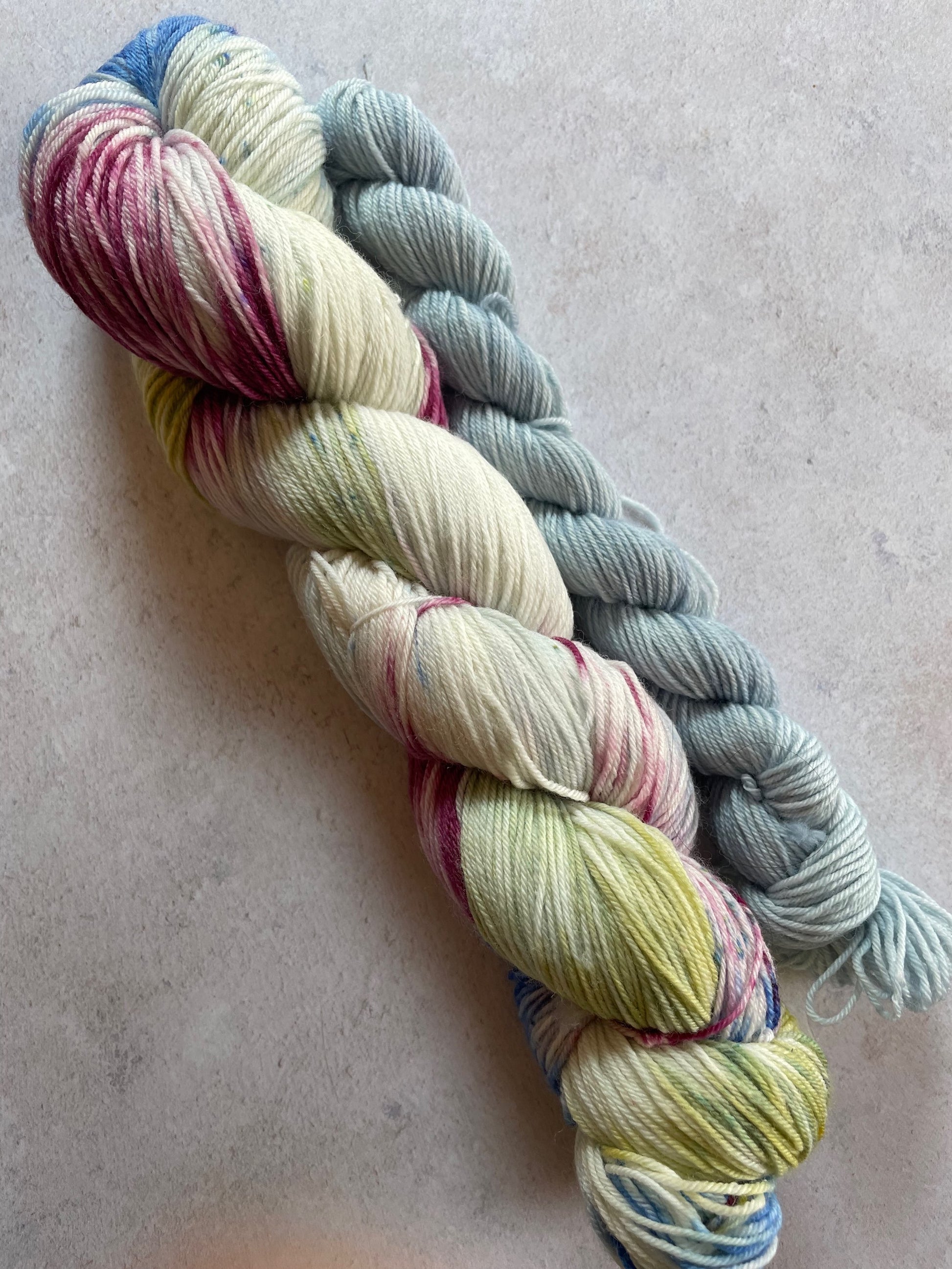 120g sock set with cream burgundy blue and green main skein and pale blue mini skein