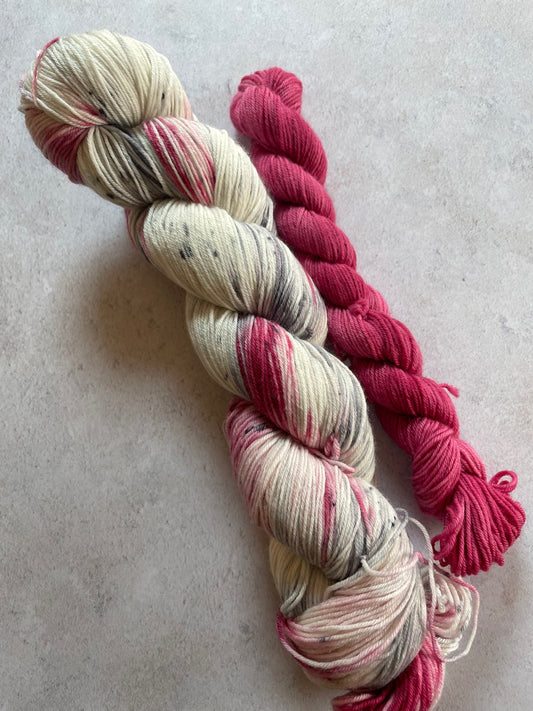 120g sock set with cream red and grey speckled main skein and red mini skein