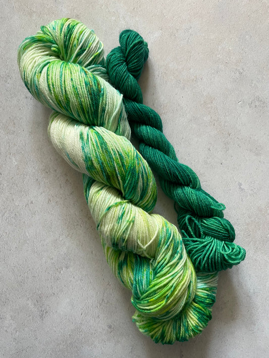 120g sock set with green speckled main skein and emerald mini skein