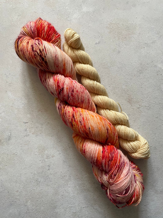 120g sock set with red and speckled main skein and cream mini skein