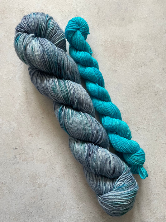 120g sock set with blue and speckled main skein and turquoise mini skein