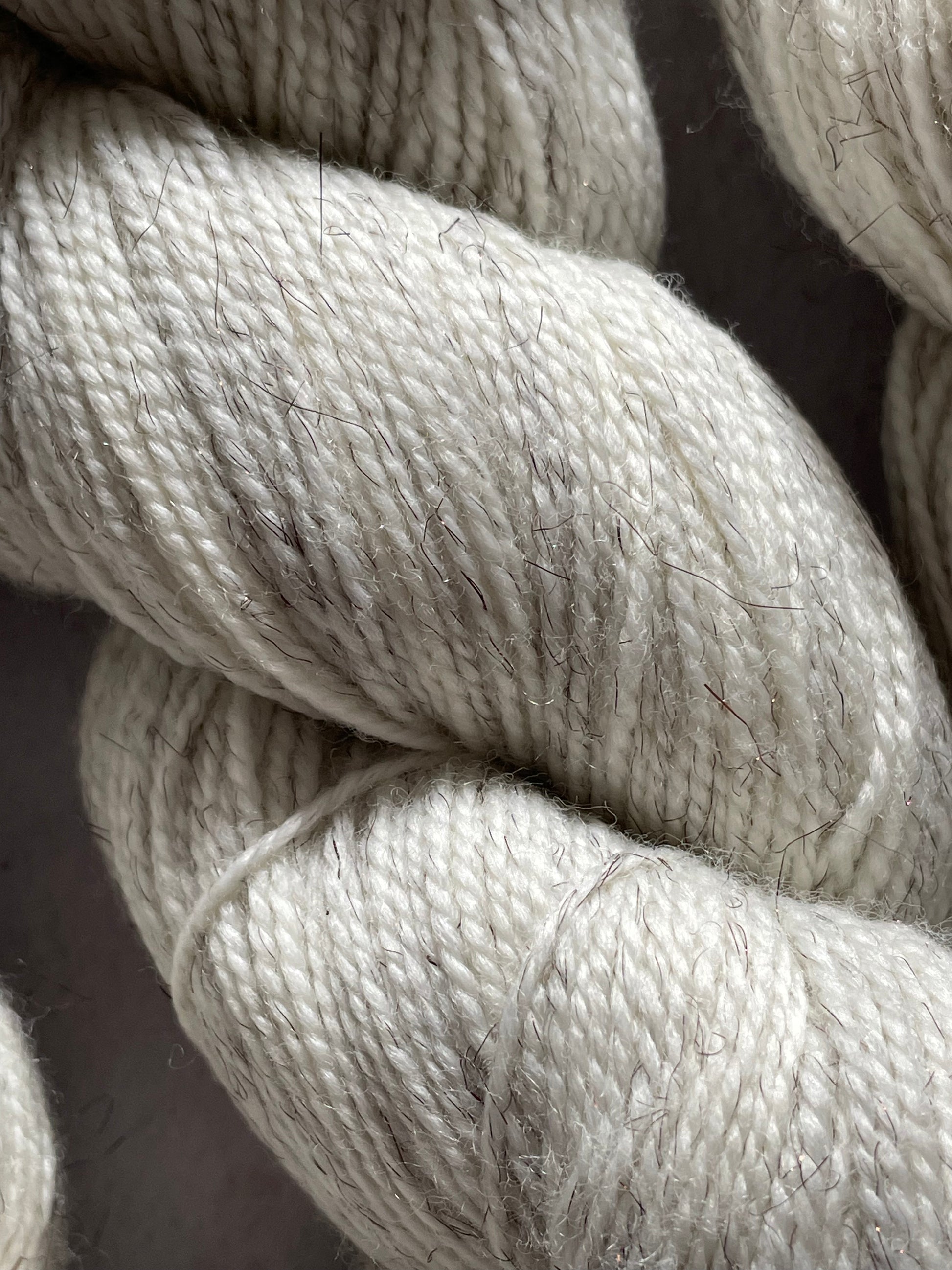 A close up of the undyed bronze sparkle sock yarn