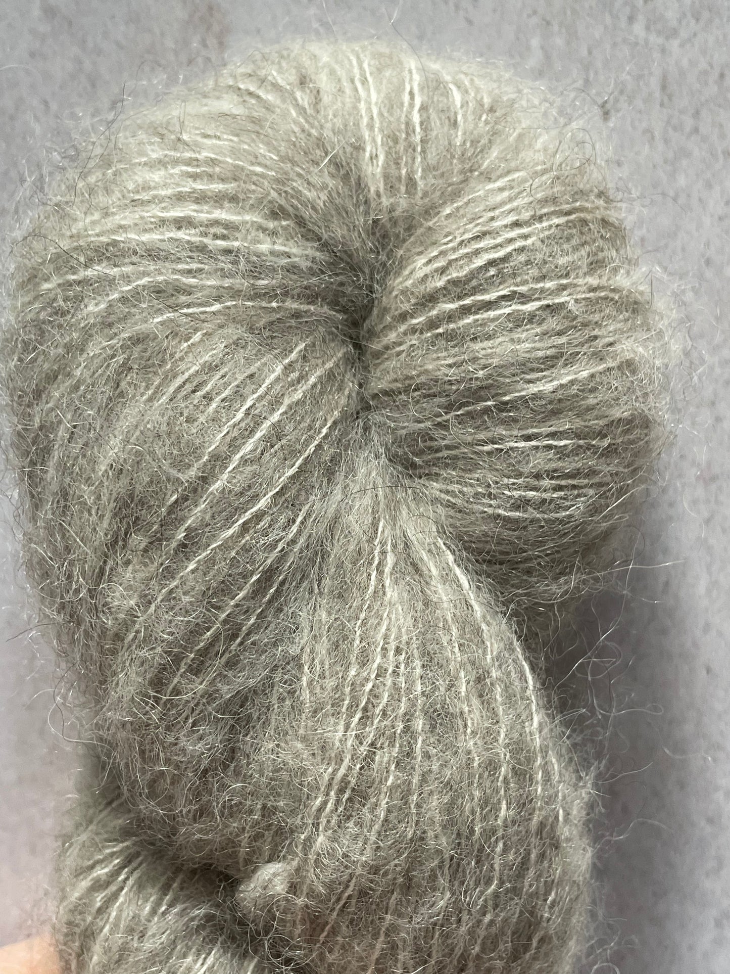 A close up of yak cloud, a grey fluffy yarn