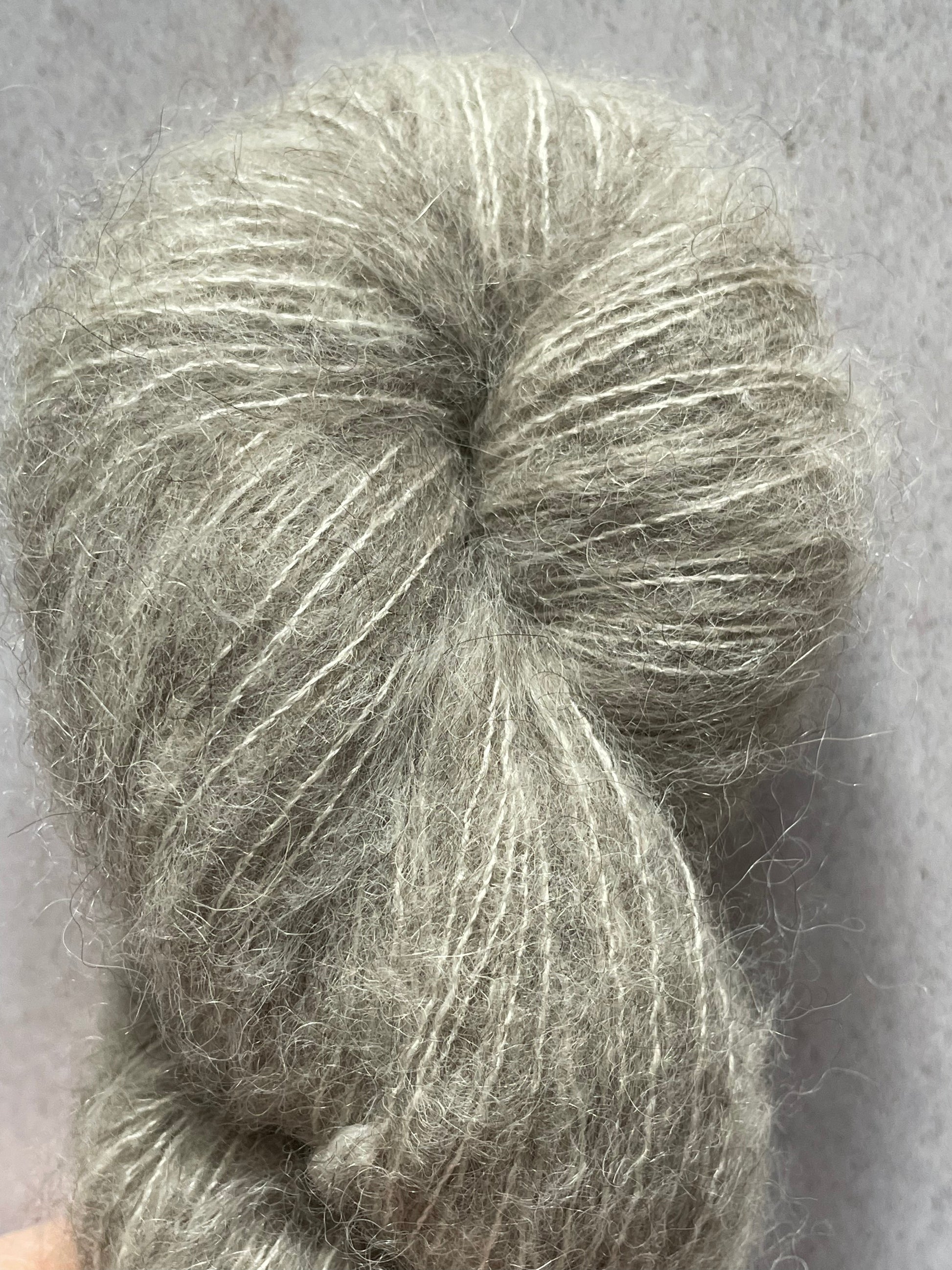 A close up of yak cloud, a grey fluffy yarn