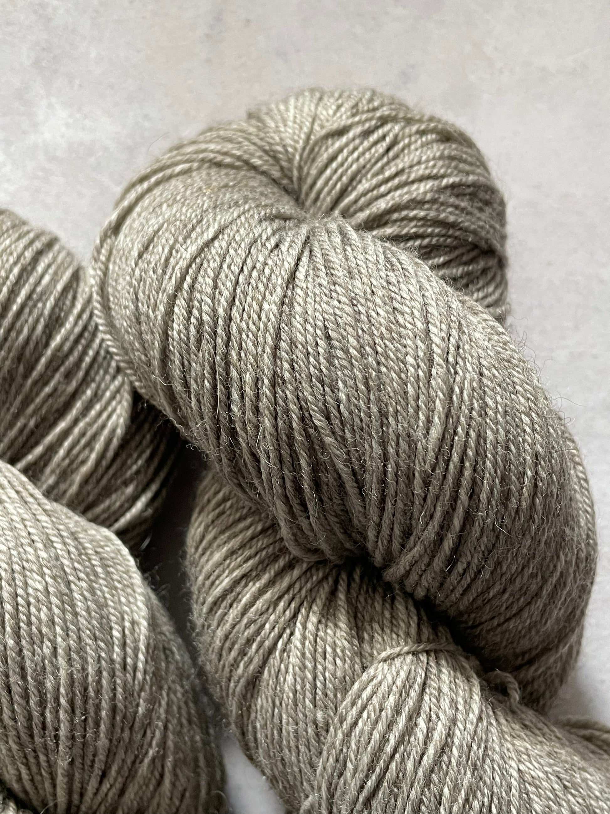 Close up of undyed grey yak sock yarn
