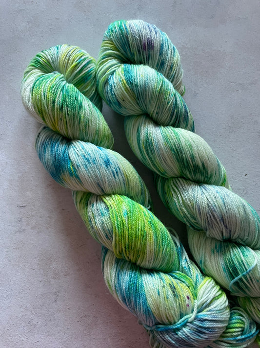 2 skeins of green and turquoise yarn