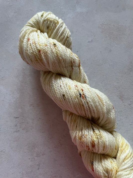 Aran yarn lightly speckled with gold