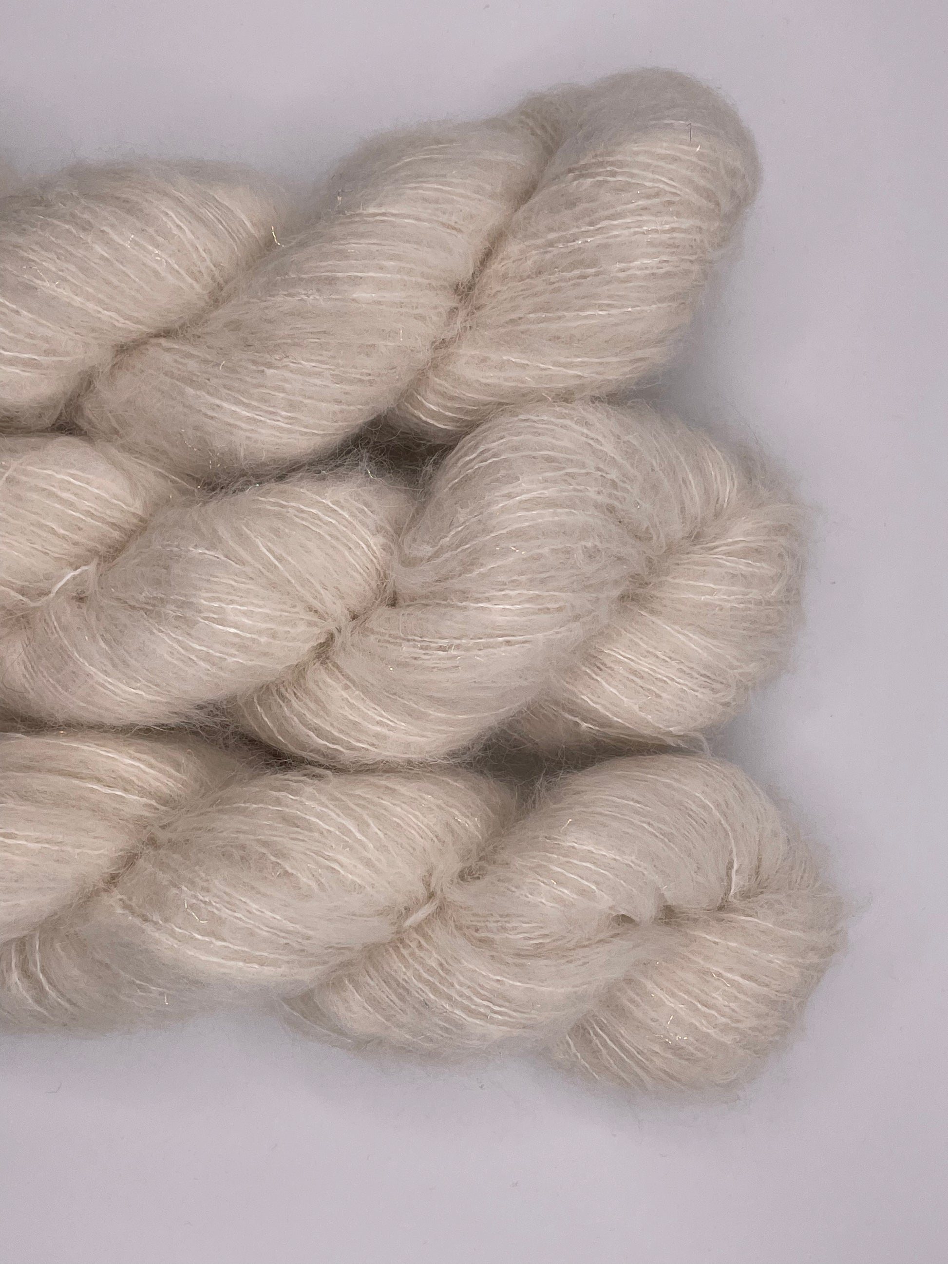 3 skeins of the suri alpaca and silk cloud base with iridescent stellina