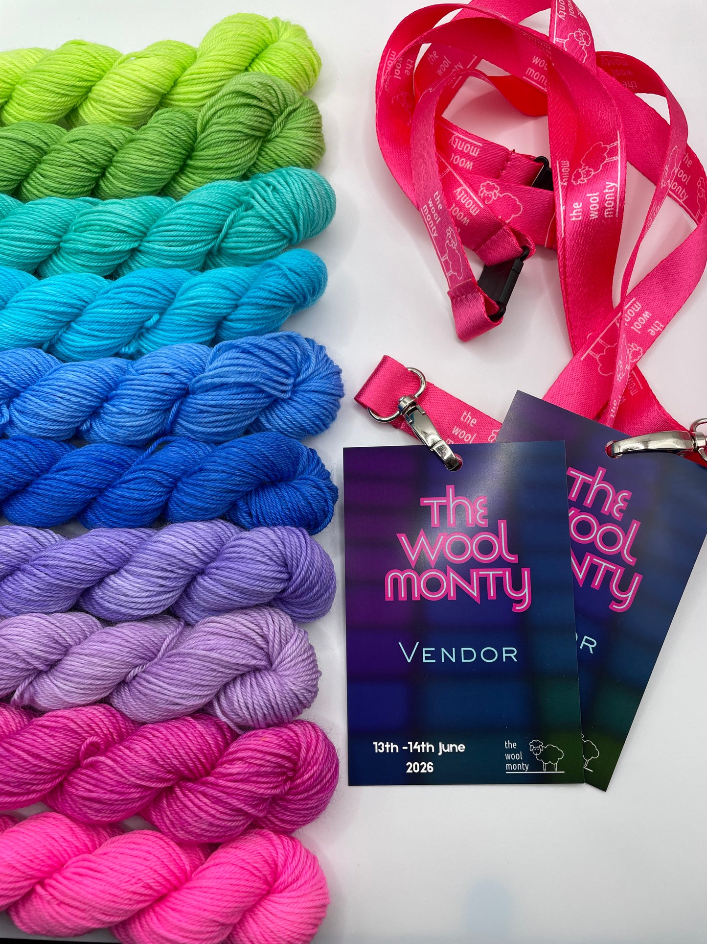Colorful yarn skeins with a 'The Wool Monty' vendor badge on a white background